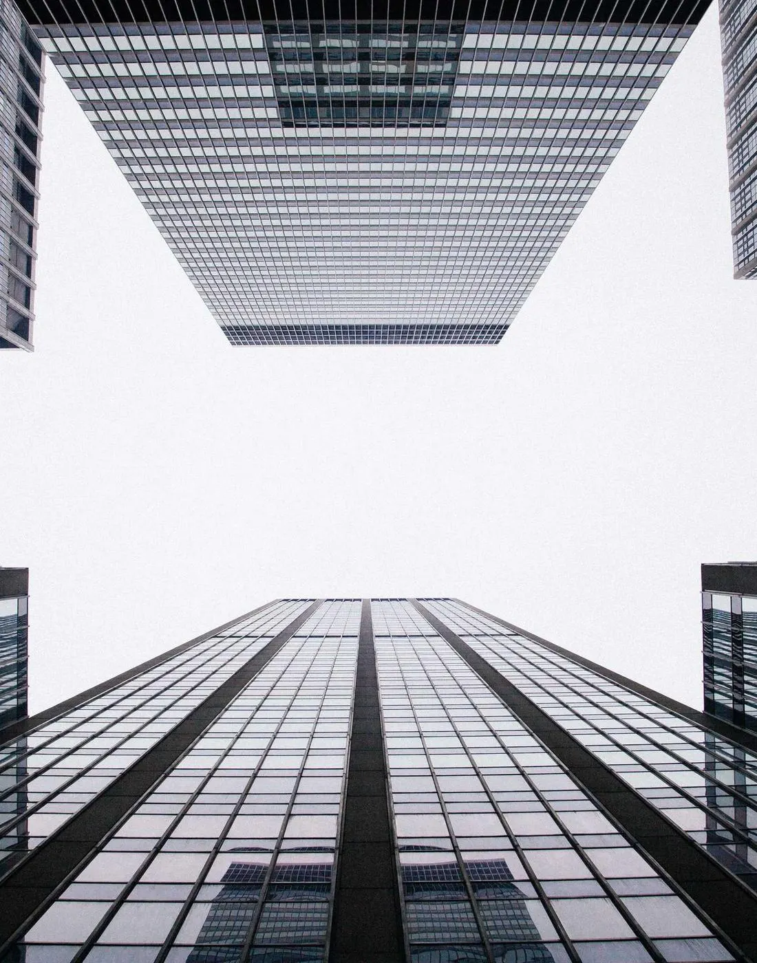 Glass office towers seen from street level
